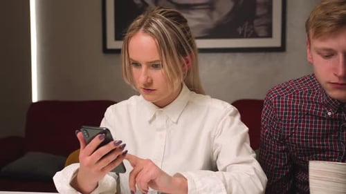 Mad Jealous Young Woman Arguing with Her Caucasian Boyfriend Checking His Phone Making Up Conflict