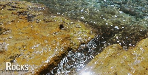 Waves Gently Crashing on Rocks by the Ocean