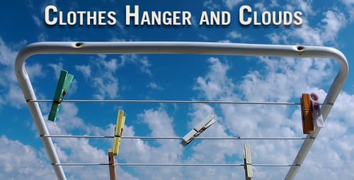 Clothes Drying Rack with Pegs Against Blue Sky