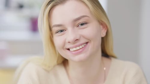 Blonde Woman Smiling in Close Up