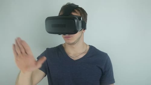 Man Wearing VR Headset Experiencing Virtual Reality