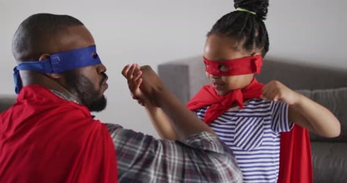 Father and Daughter Superhero Playtime at Home