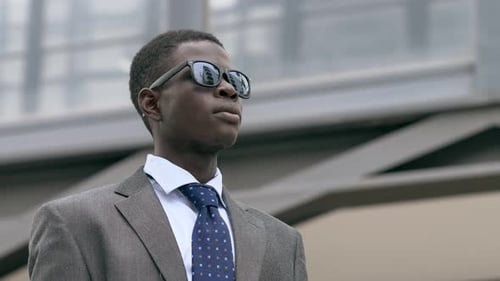 Young Adult in Suit Stands Tall