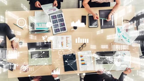 Business Meeting with Data Graphics at Table