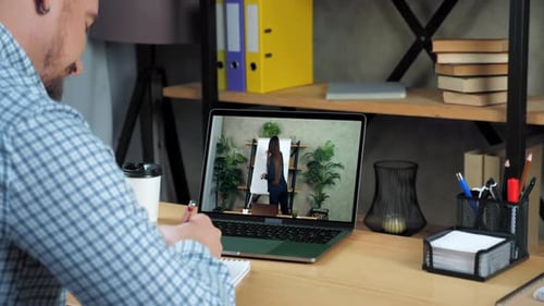 Businessman Writes in Notebook Study Watch Business Online Course Laptop Webcam