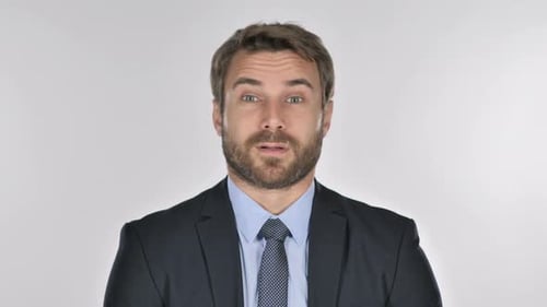 Man in Suit Opens Eyes and Smiles