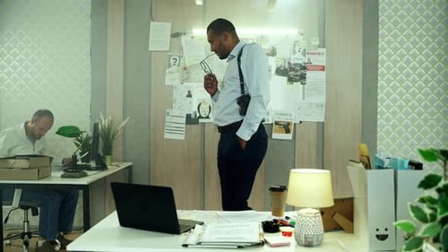 Detectives Working Together in Office Environment