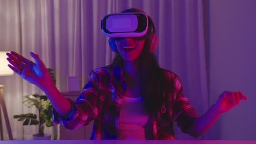 Young Woman Immersed in Virtual Reality Gaming at Home