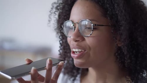 Woman Using Voice Assistant on Smartphone