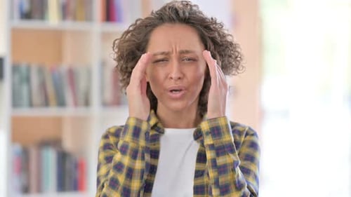 Portrait of Mixed Race Woman Having Headache