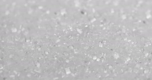 Stack of white sugar in rotation