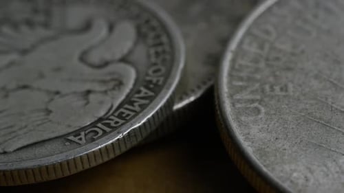 Rotating stock footage shot of antique American coins - MONEY 0097