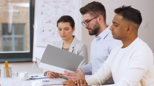 Diverse Team Meeting in Bright Modern Office