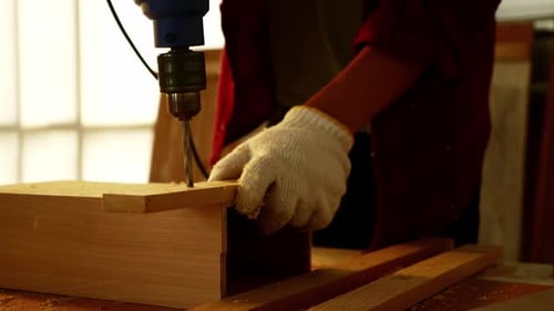 Woodwork and furniture making concept. Stylish craftsman working in his carpentry workshop