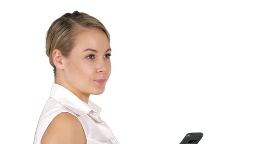 Woman Looking At Cell Phone And Smiling