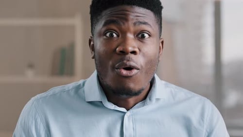 Man's Face Expressing Surprise and Happiness