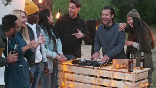 Friends Enjoy Music at a Wooded Party