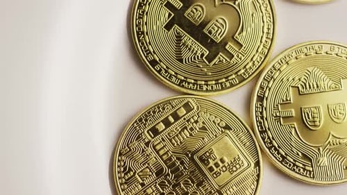Golden Bitcoin Coins Representing Digital Cryptocurrency