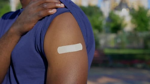 Adhesive Bandage on Arm After Vaccination
