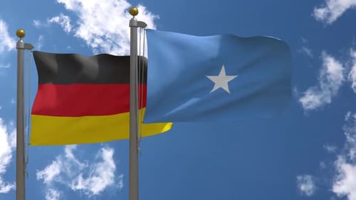 Waving Flags of Germany and Somalia on Flagpoles