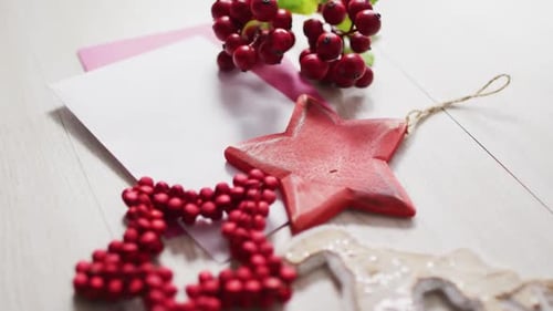Christmas Card with Red Ornaments on Table