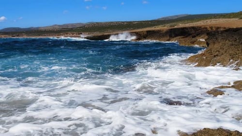 Sea Blue Water and Rocks Sunny Daytime Seascape Devastating and Spectacular Ocean Waves Crash on the
