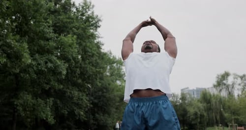 Sportsman Preparing for a Workout at Outdoor in Park