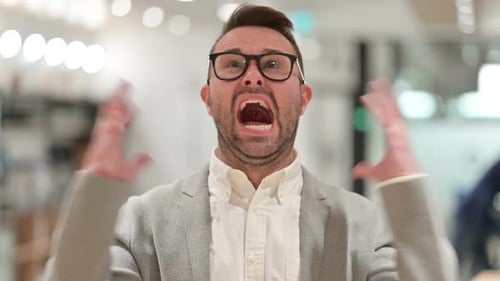 Man Shouts in Office Setting