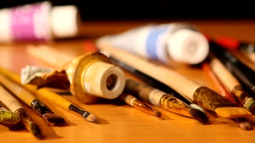 Paintbrushes and Paint Tubes on Surface
