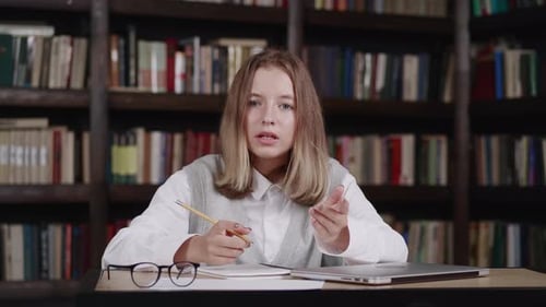 Happy Schoolgirl Pupil Wearing Headphones Raising Hand Distance Learning Online at Virtual Lesson