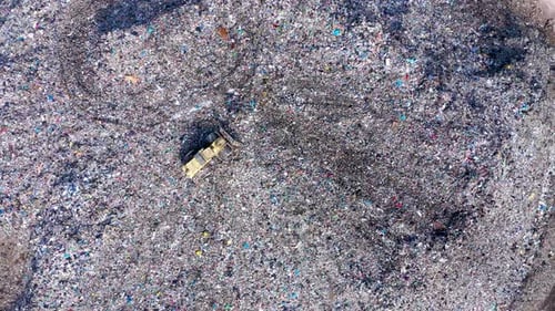 Aerial View: Landfill with Trash, Garbage, and Tractor