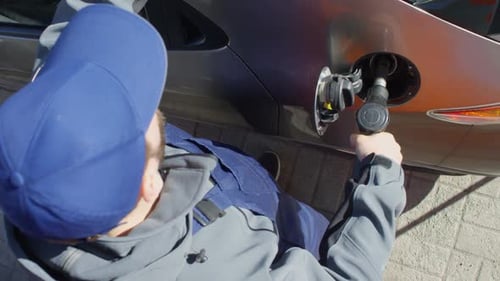 Gas Station Worker Refueling Client’s Car