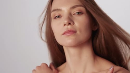 Glamorous Woman Posing with Windswept Hair