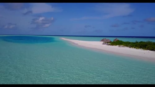 Aerial above seascape of tranquil shore beach adventure by blue ocean with white sand background of
