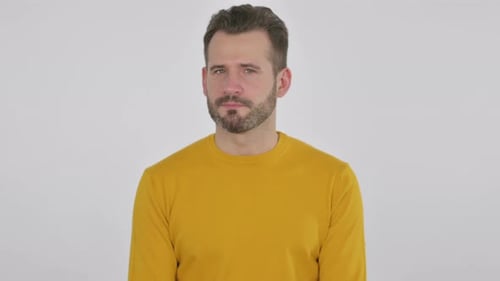 Serious Man Looking at Camera in Studio