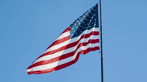 American Flag Waving Under a Clear Blue Sky