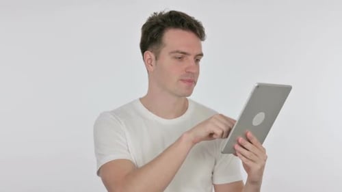 Young Adult Using a Tablet on White Background