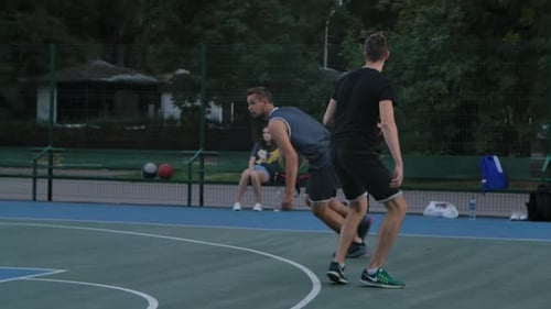 Skilful Guy Basketball Player in Uniform, Dribbles the Ball, Passes the Opponent's Defender and