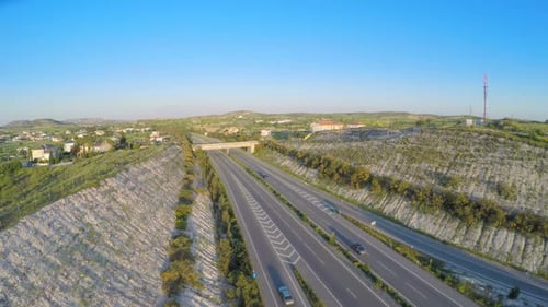 Cars Driving on Modern Highway. Aerial Shot of Traffic. Video Filmed With Drone