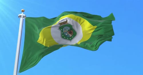 Flag Waving Against Blue Sky With Coat Of Arms