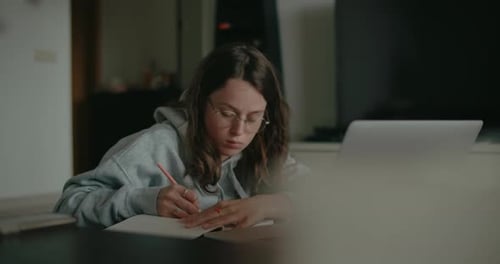 Millennial Woman at Home Work on Project or Study