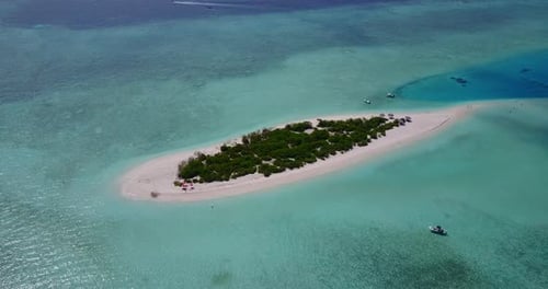 Daytime drone island view of a white paradise beach and turquoise sea background in vibrant 4K