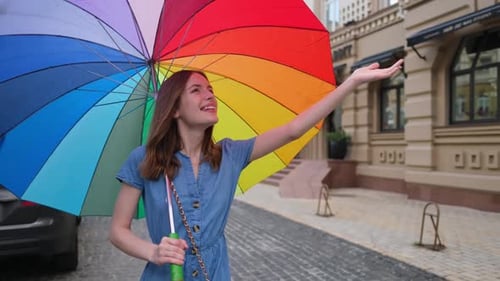 Woman with Colorfull Umbrella at the City Center