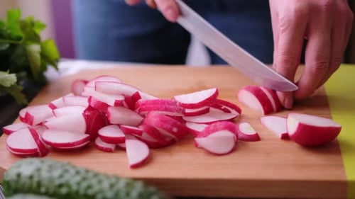 Radishes Sliced Neatly on Wood Cutting Board