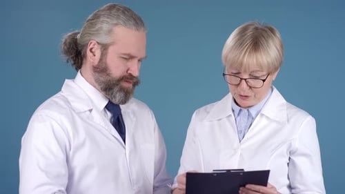 Medical Team Consults on Patient Data