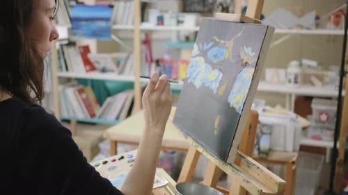 Adult Female Painter Is Drawing Abstract Picture in Her Creative Studio