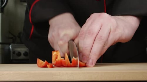 Chef Dicing Red Pepper With Precision Knife Skills