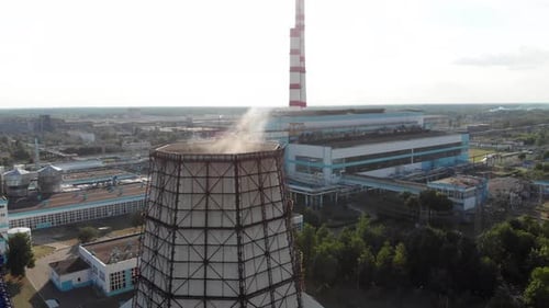 Drone Footage of a Thermal Power Plant and Smoke From a Cooling Tower Against the Backdrop of a