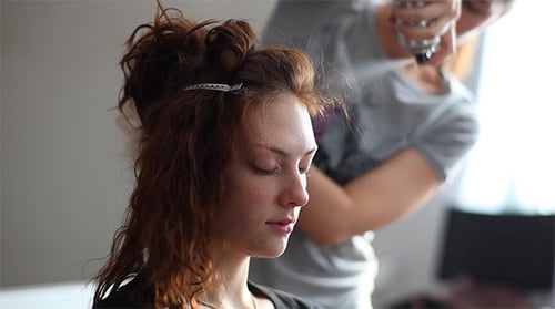 Woman Having Hair Styled at Home Indoors