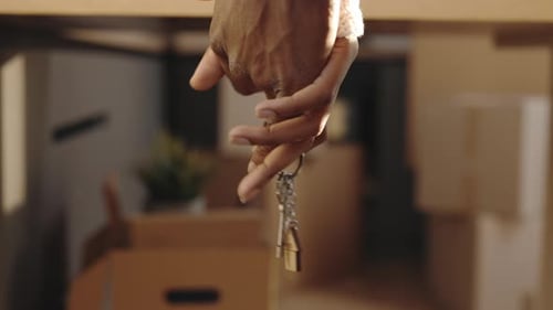 Hands Holding House Keys in New Home